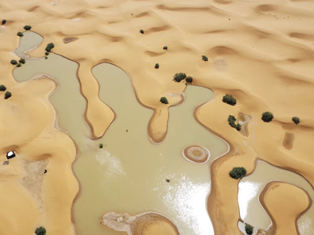 A view of lakes caused by heavy rainfall between sand dunes in the desert town of Merzouga, near Rachidia, southeastern Morocco, Wednesday, Oct. 2, 2024. (AP Photo)